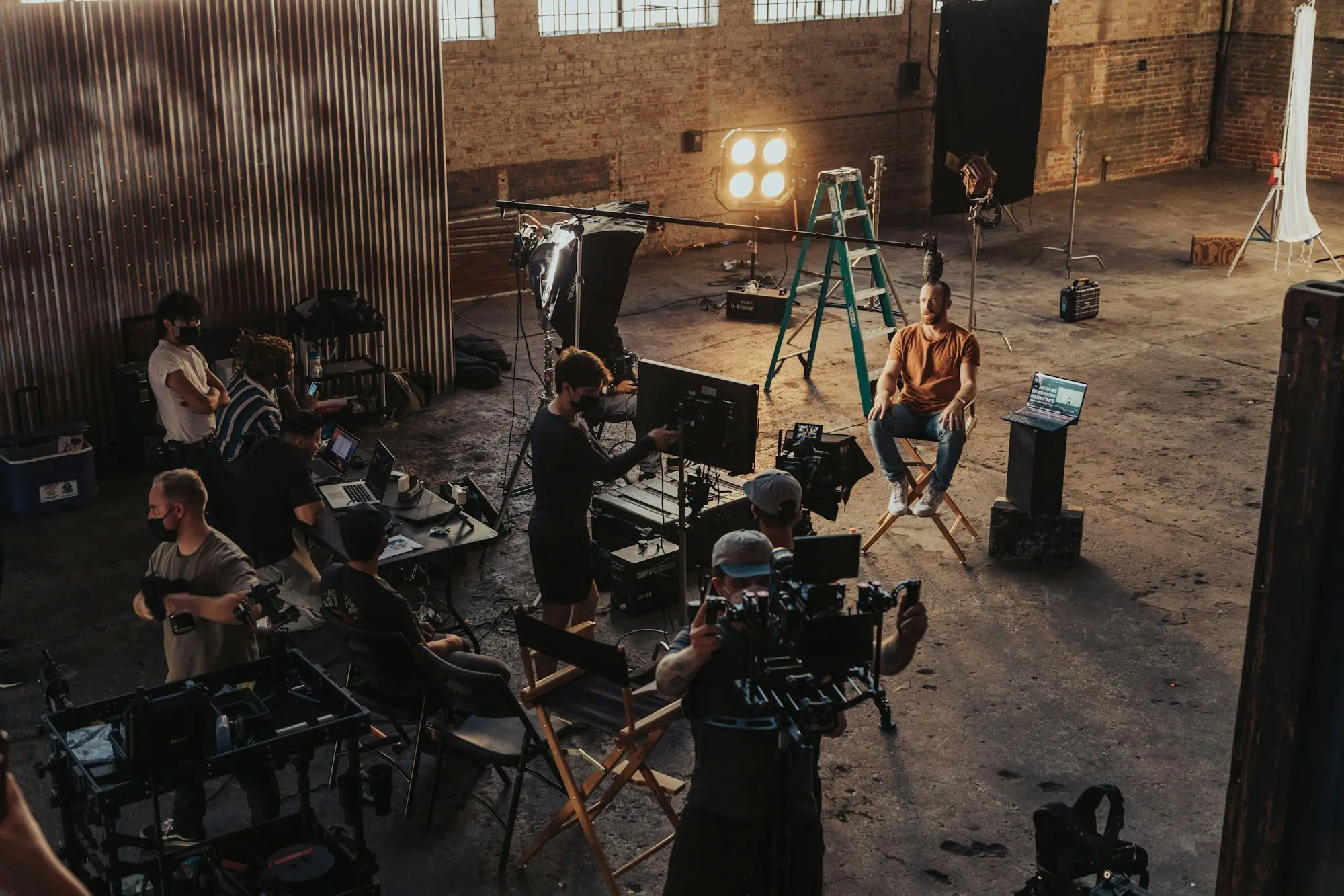 Camera crew gathered around a cinema camera during a take