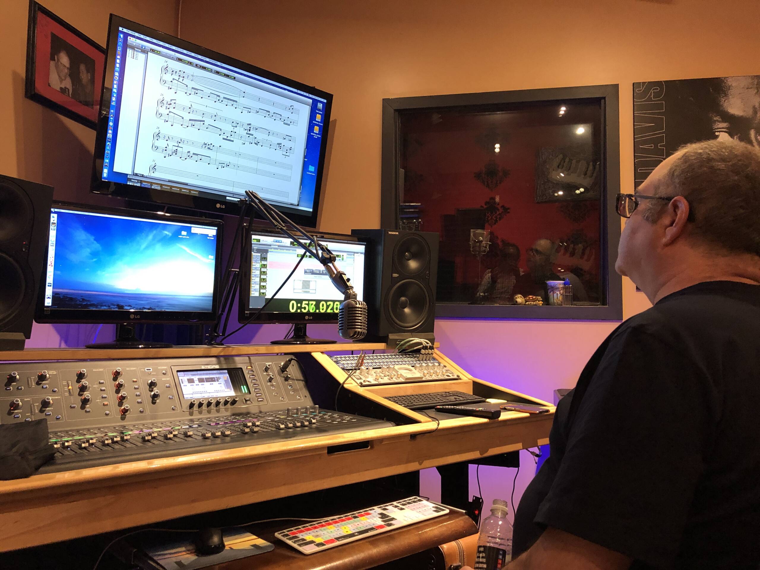 A black and white image of Angelina Alvardo using a digital audio workstation.